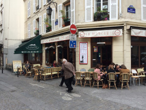 Sidewalk Café Seating at La Montange is Right Next to Slow-Moving Rue Tournefort